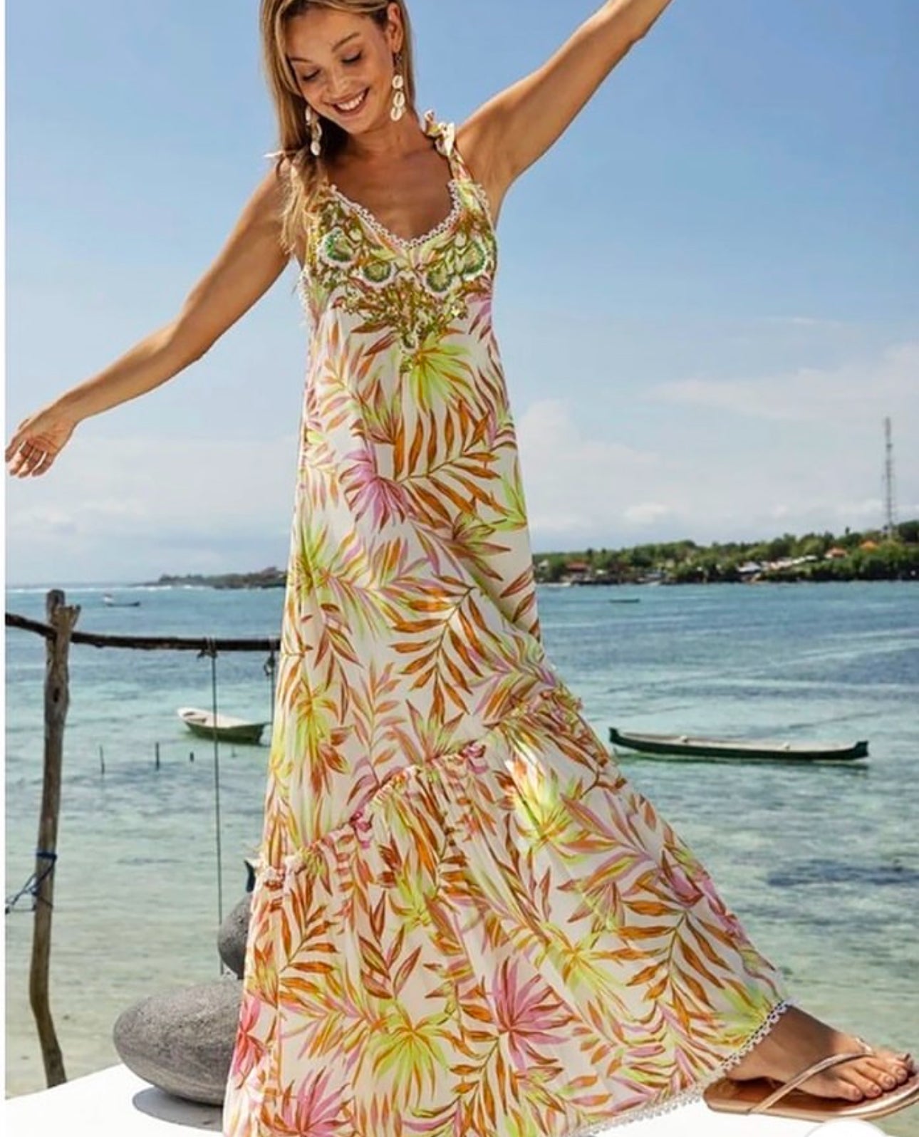  Miss June Long Isla Dress in Multi features a vibrant, eye-catching print. Made from high-quality fabric, it combines comfort and style, making it perfect for any occasion.